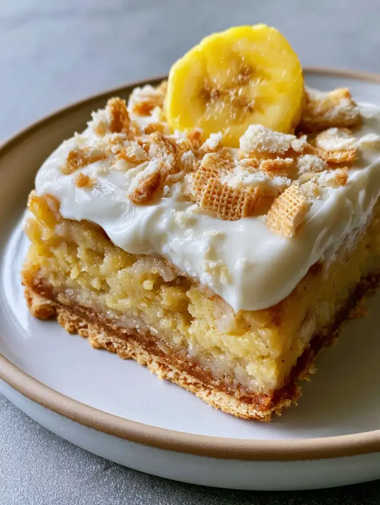 Banana Pudding Brownies: The Ultimate Fudgy Southern Dessert 1 Top down shot of banana pudding brownies garnished with fresh banana slices and Nilla Wafers.