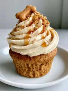 A handheld smartphone photo showing the moist, golden-brown crumb of a Dog Birthday Cupcake. (Dog Birthday Cupcakes)
